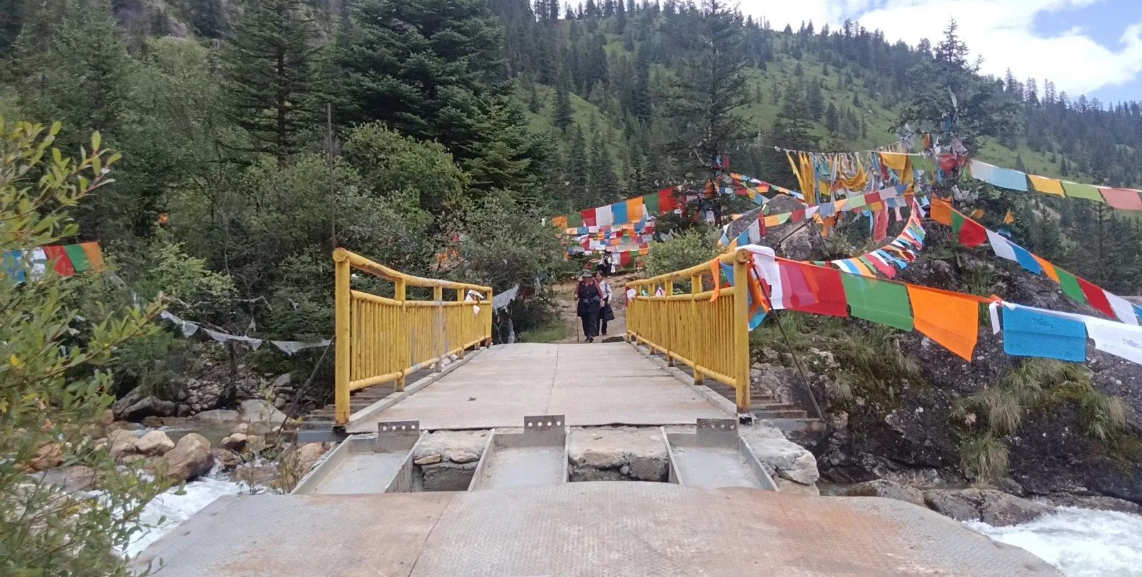 A bridge hung with prayer flags