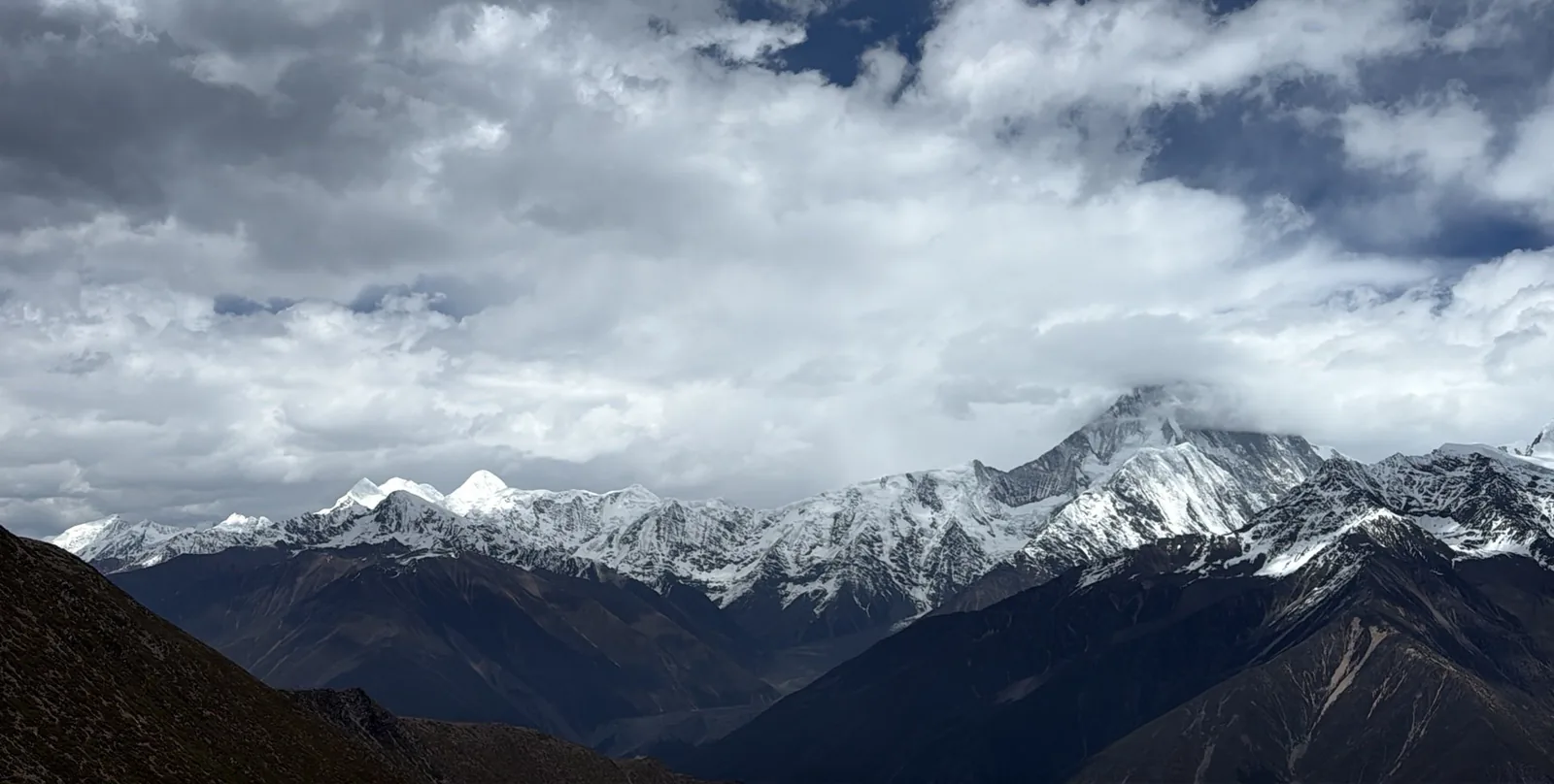 Snow peaks above the ridge